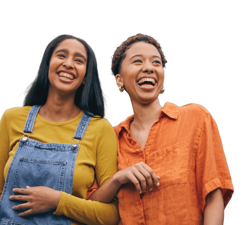 TRS Healthcare - Grow the Family / Refer a Friend (Transparent) Cutout of two young friends walking arm-in-arm laughing against a transparent background