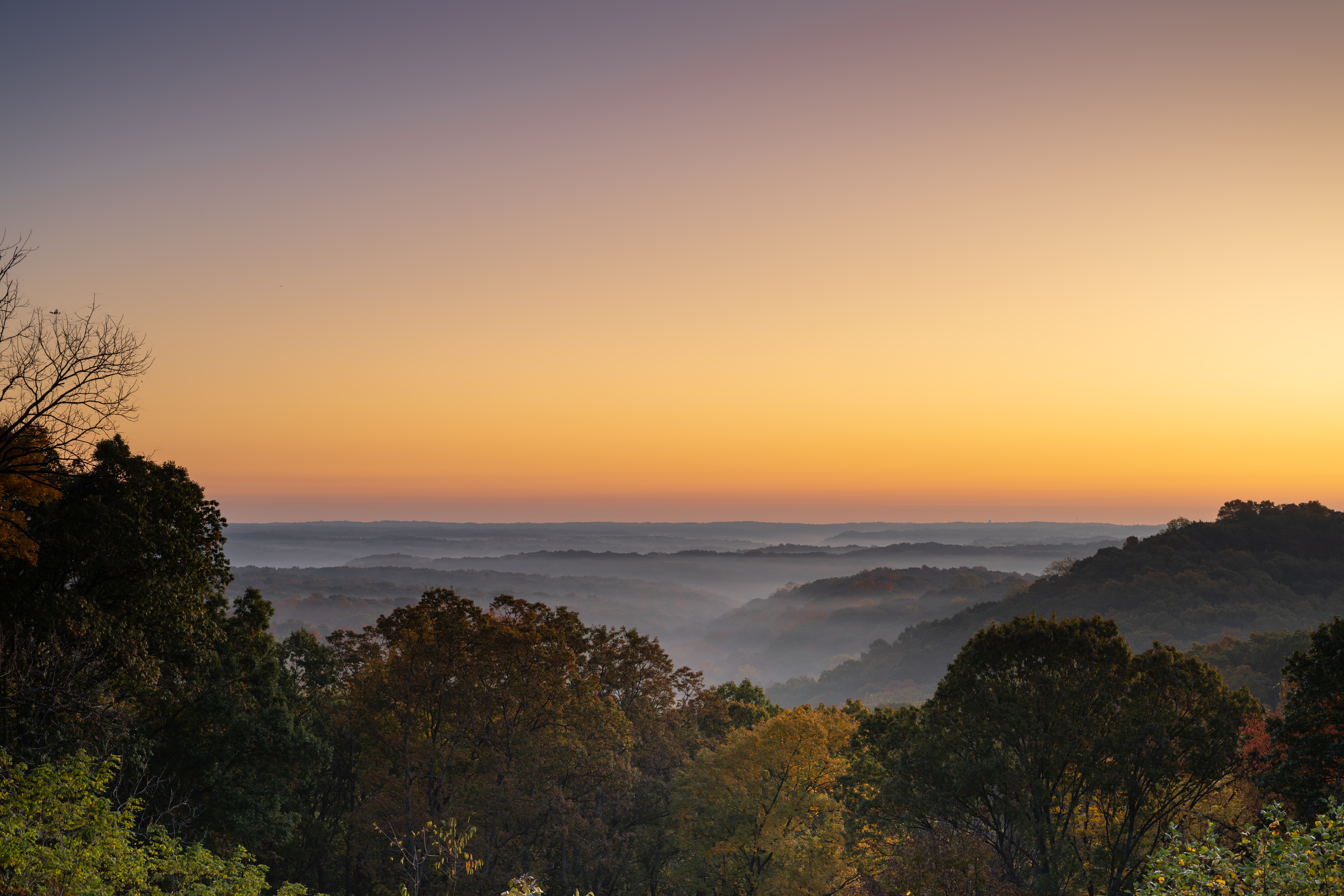 Travel Healthcare Jobs in Indiana Early morning mist in an October morning as the sun rises at Brown County State Park in Indiana