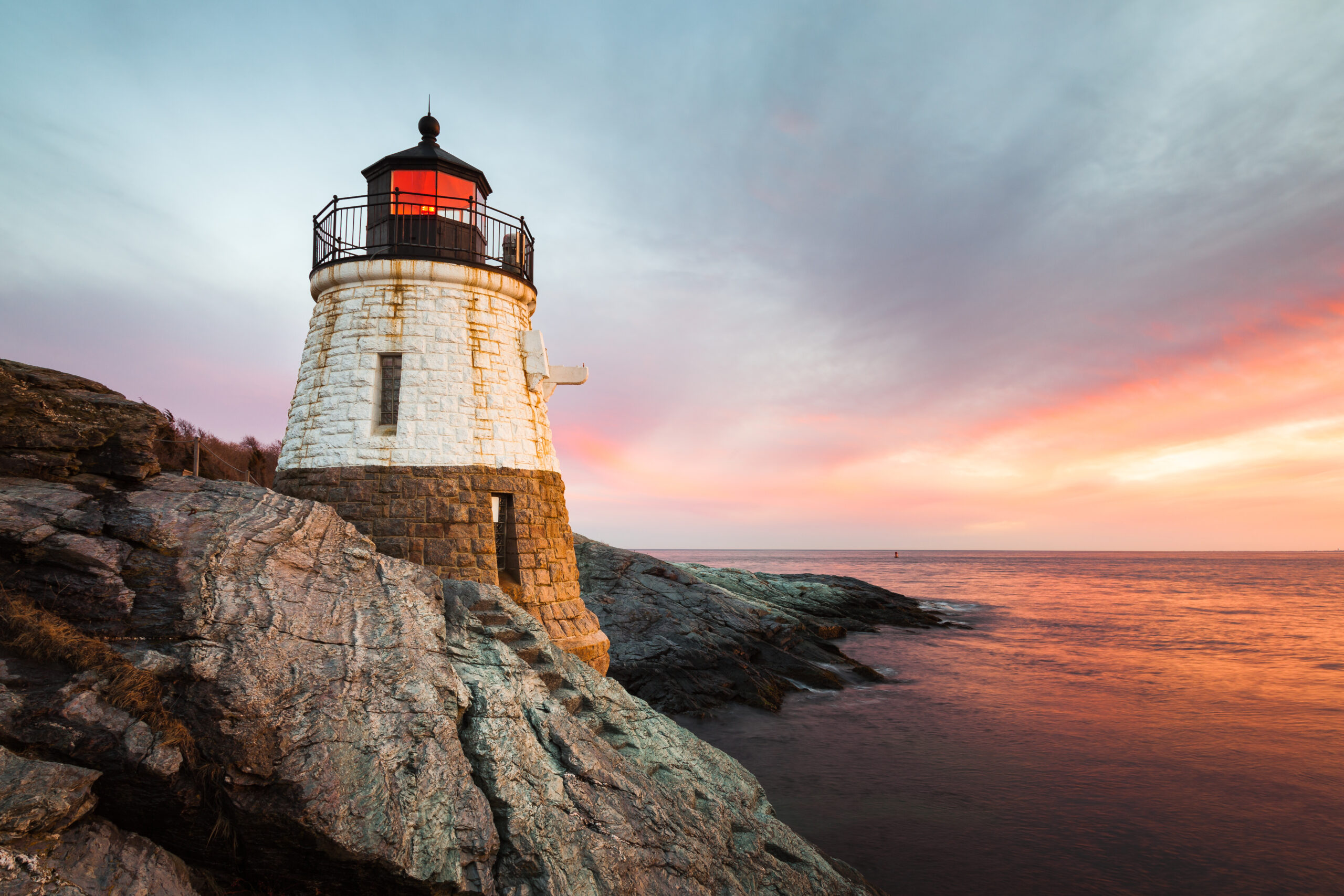 Travel Healthcare Jobs in Rhode Island Small, white, granite built Castle Hill Lighthouse sits on the rocky coastline of Newport, Rhode Island on the Atlantic coast of New England