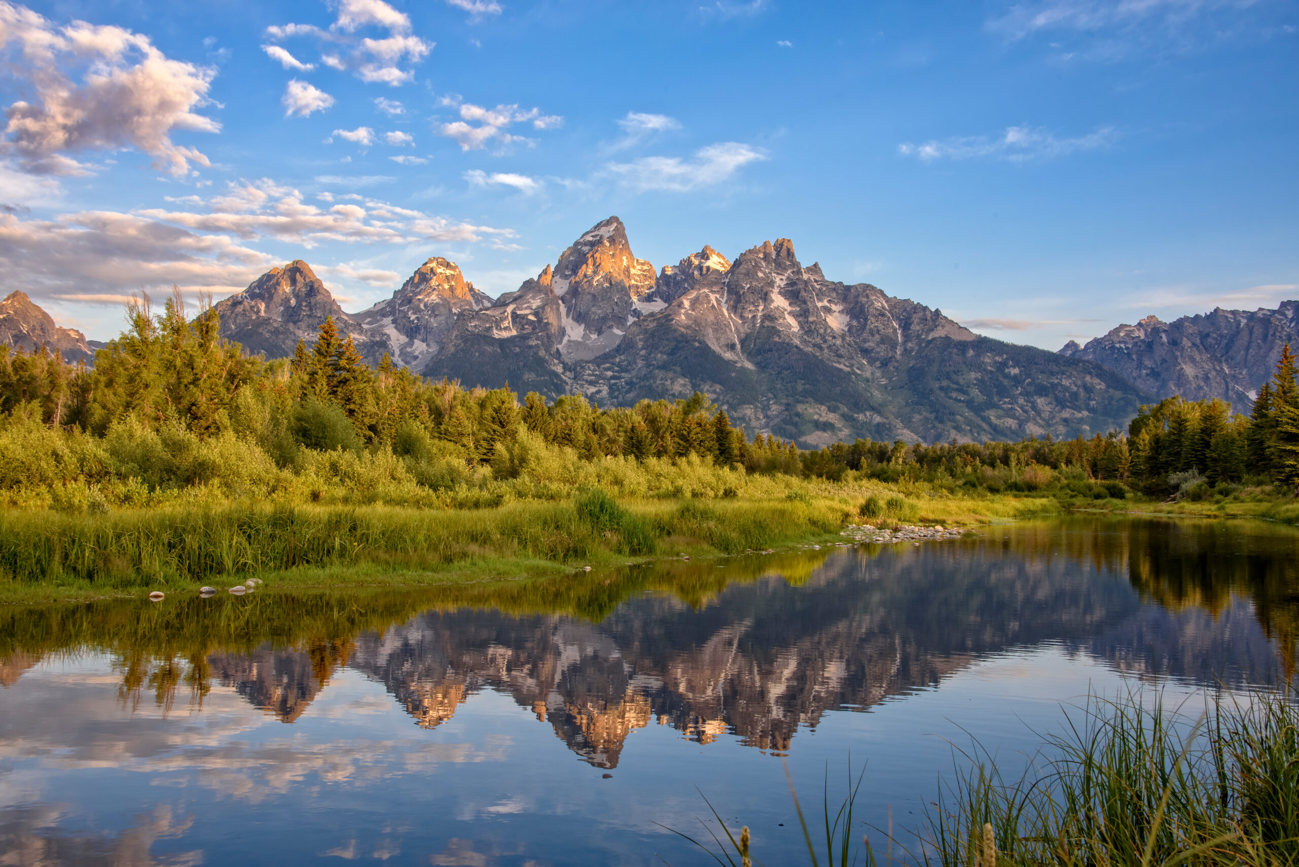 Travel Healthcare Jobs in Wyoming Schwabacher's Landing, Jackson Hole, Wyoming. The Grand Teton mountains are seen at dawn reflected in the still water of the Snake River
