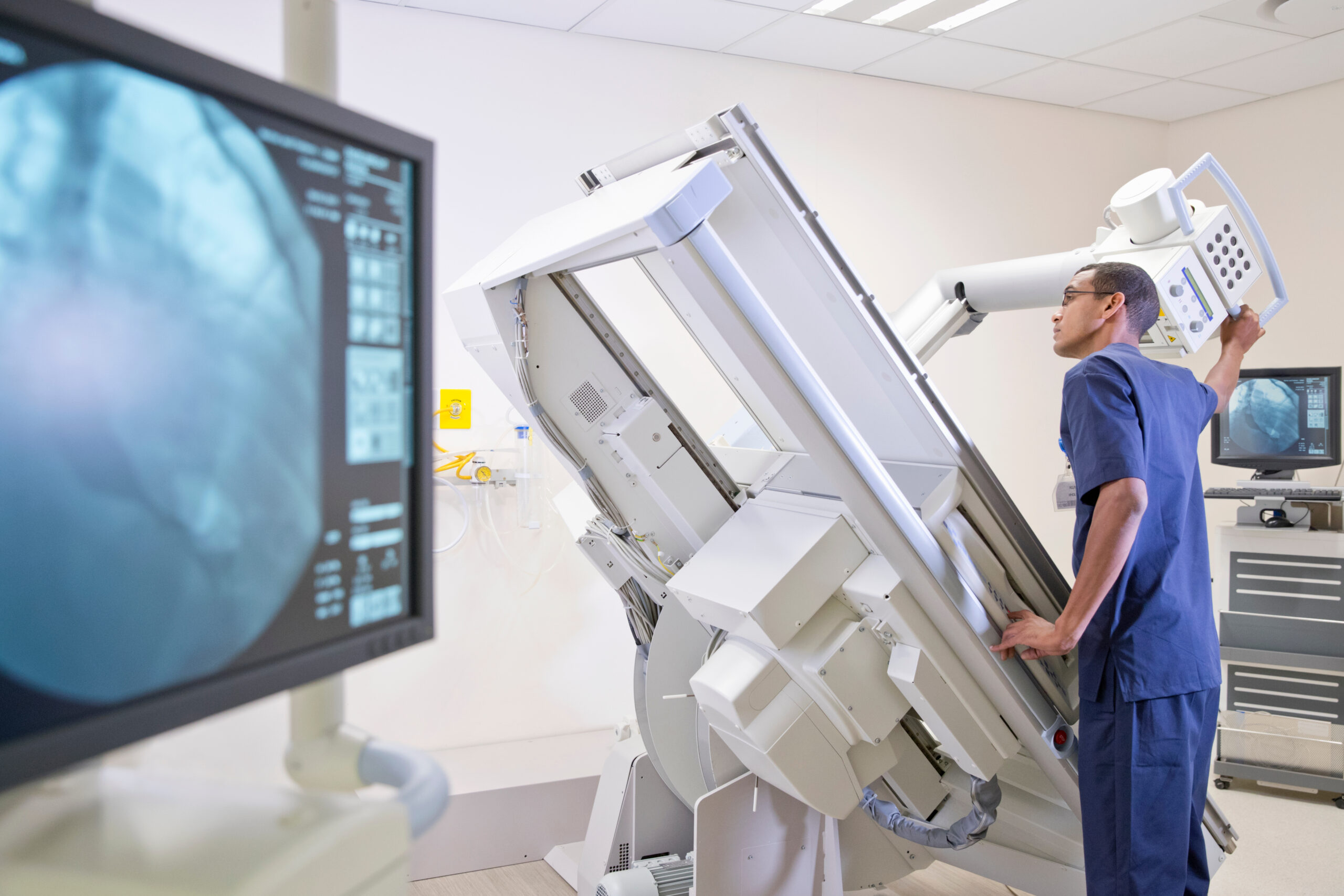 Why You Should Become an Allied Health Traveler Male radiographer working in hospital X-ray department